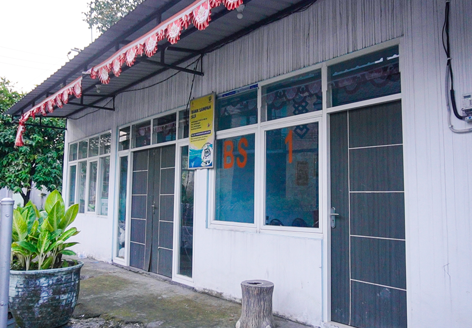Small building with blue door and windows labeled BS 5